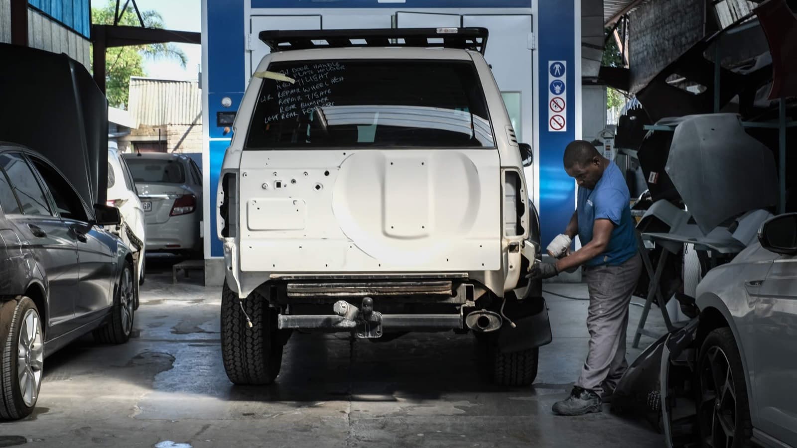 Collision-damaged SUV being repaired at Brilliant Shine